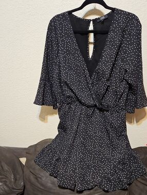 OHS Black Polka Dot Wrap Romper with Ruffle Hem